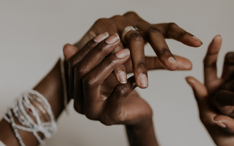 Hands illustrating gentle touch therapy